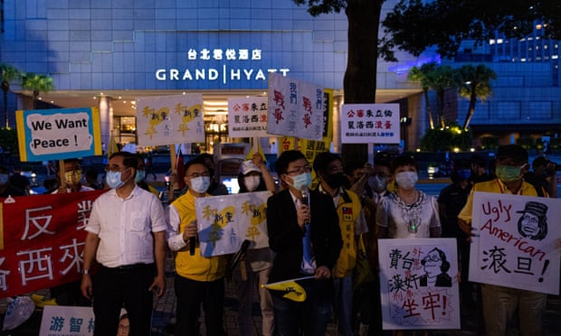 Demonstrators protest against Nancy Pelosi’s visit outside the Grand Hyatt hotel in Taipei