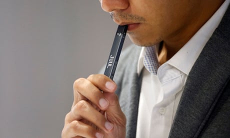 FILE PHOTO: A shopkeeper demonstrates smoking a Juul brand vaping pen to customers at a Juul shop in Jakarta, Indonesia, December 30, 2019. REUTERS/Ajeng Dinar Ulfiana/File Photo FILE PHOTO: A shopkeeper demonstrates smoking a Juul brand vaping pen to customers at a Juul shop in Jakarta, Indonesia, December 30, 2019. REUTERS/Ajeng Dinar Ulfiana/File Photo