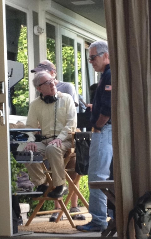Jeffrey Epstein chats to director woody Allen, who looks to be at work.