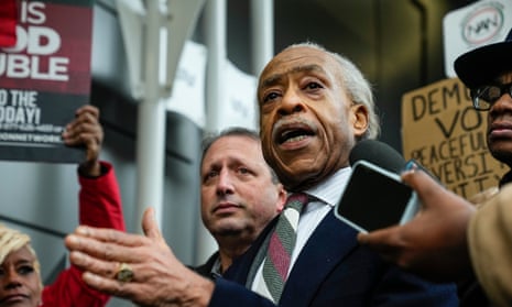 Rev Al Sharpton speaks to the media during a protest