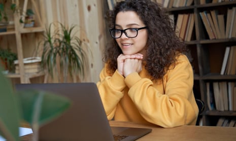 student looking at laptop at home
