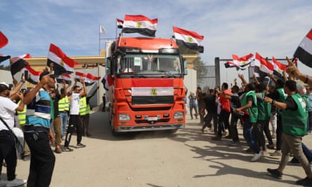 A crow waving Egyptian flags lorry celebrate the return of an aid lorry from Gaza