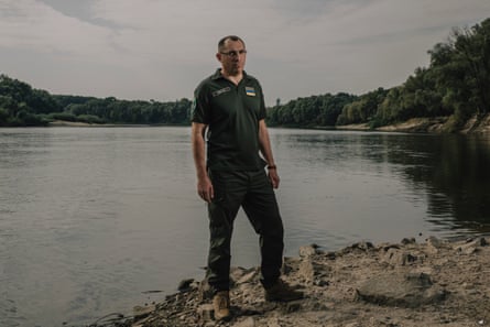 A man stands near to water at Chernihiv’s central beach.