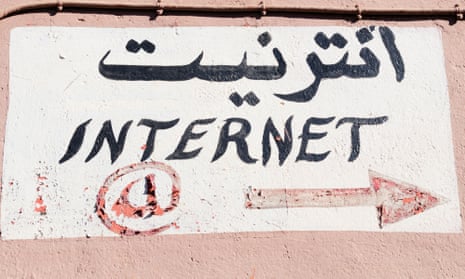 A sign in Arabic on the side of an internet cafe in Morocco.