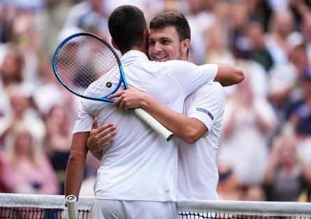Novak Djokovic and compatriot Miomir Kecmanovic embrace.