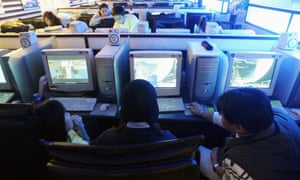 South Korean students play computer games at an Internet cafe in Seoul