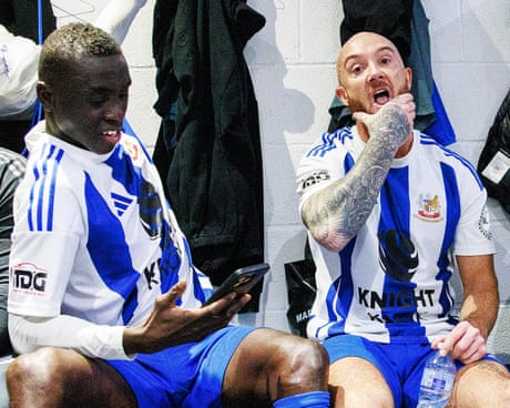 Papiss Cissé and Stephen Ireland in the changing room at half-time during the match between Wythenshawe and South Liverpool