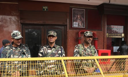 Indian Security personnel stand guard during the screening of Bollywood movie ‘Padmavat’ at a cinema hall in New Delhi, India
