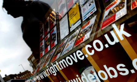 A Rightmove sign on an estate agent’s window in London