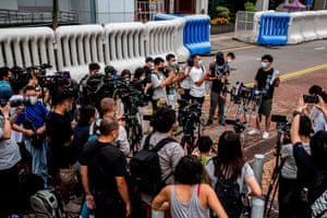 Pro-democracy activist Joshua Wong speaks to the media after being arrested for unlawful assembly related to a 2019 protest against a government ban on face masks.