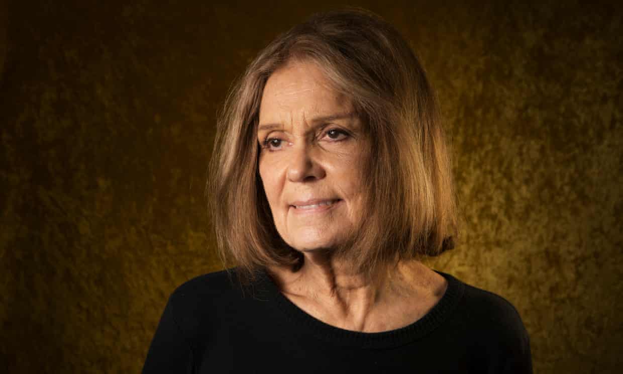 Gloria Steinem, with shoulder-length hair, slightly smiling