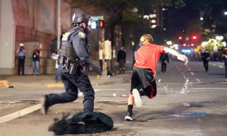 A federal officer attempts to arrest a protester on Tuesday in Portland, Oregon.