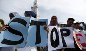 Indonesian female activists demonstrate during a peace rally against sexual violence on children and women