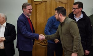 Ukrainian president Volodymyr Zelenskiy shakes hands with Czech prime minister Petr Fiala before a joint press conference following talks at a secure location in Kyiv