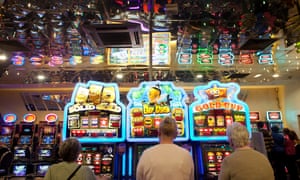 Customers play on the fruit machines at the Gala Bingo Hall in Stratford, London.