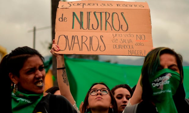 Activists backing the decriminalization of abortion hold a demonstration outside the national assembly building in Quito on Tuesday.