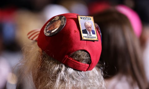 A supporter listens as former president Donald Trump speaks during a 2024 presidential campaign rally in Dubuque, Iowa, on Wednesday.