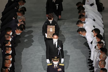 Widow of former Japanese Prime Minister Shinzo Abe, Akie Abe carries her husband’s urn during the state funeral, at the Budokan in Tokyo.