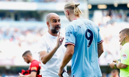 Pep Guardiola talks to Erling Haaland during Manchester City’s 4-0 win against Bournemouth