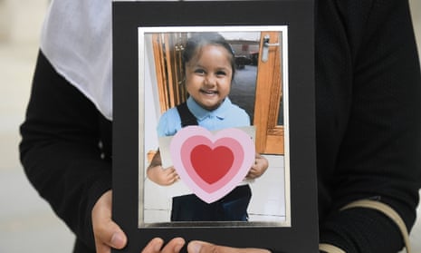 Shelina Begum holds a picture of her five-year-old daughter Tafida Raqeeb.