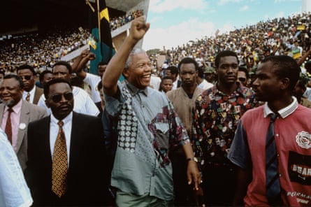 Nelson Mandela waves at a huge crowd in 1994
