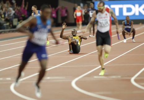 Usain Bolt pulls up injured as Great Britain’s Daniel Talbot celebrates.
