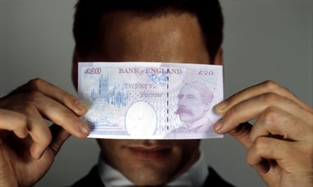 A man with a 20 pound note