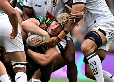 Henry Pollock is wrapped up by Exeter players in the 2026 Prem final