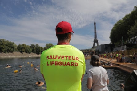 A lifeguard watches swimmers
