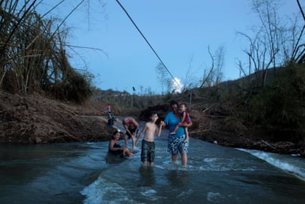 Puerto Ricans in San Lorenzo in the river after Hurricane Maria destroyed the town’s bridge, October 2017.
