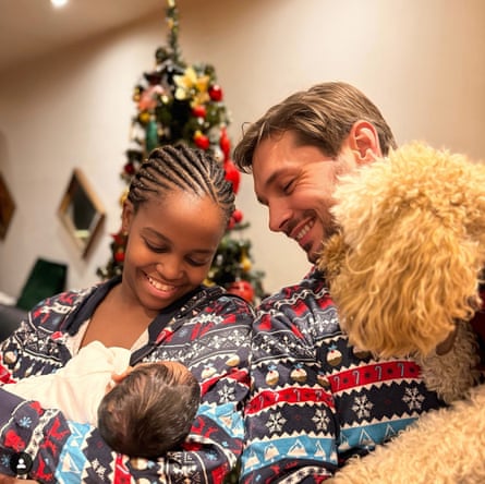 With her husband and their new baby in 2023.