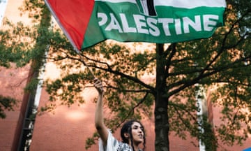 Pro-Palestine Encampment at George Washington University in Washington, DC, USA - 07 May 2024<br>Mandatory Credit: Photo by Candice Tang/SOPA Images/REX/Shutterstock (14468293m) A woman waved a Palestine flag during an encampment at University Yard at George Washington University on May 7, 2024, in Washington, D.C. It is the twelfth day of the pro-Palestine encampment at GWU as cease-fire talks to end the war in Gaza continue. Hamas is agreeing to free hostages for an Israeli troop withdrawal. The president of George Washington University called the ongoing protest encampment on campus unlawful and warned of the potential danger it is growing into. Pro-Palestine Encampment at George Washington University in Washington, DC, USA - 07 May 2024