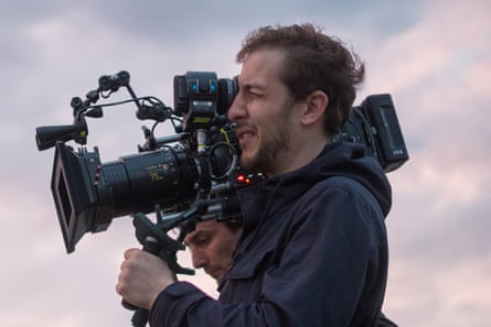 Rachid Hami looking into camera.