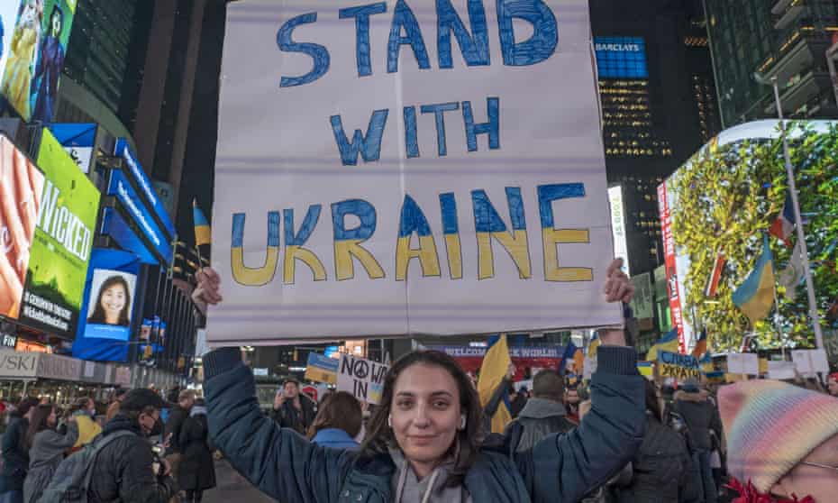 A protester holds a placard during the 'Stand with Ukraine' rally in Times Square, New York.