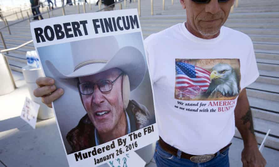 A supporter of Nevada rancher Cliven Bundy holds a sign of Arizona rancher LaVoy Finicum in front of the US courthouse in downtown Las Vegas.