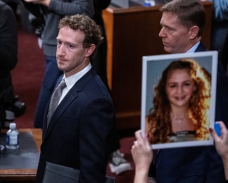 Person walks past image of girl
