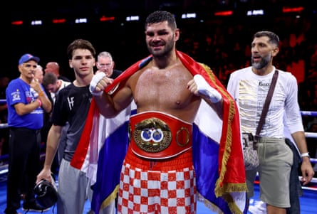 Filip Hrgovic poses for a photo with his IBF world heavyweight belt