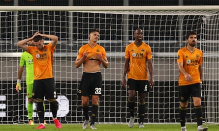 Wolves players look dejected after Lucas Ocampos’s 88th-minute goal for Sevilla in the MSV Arena.