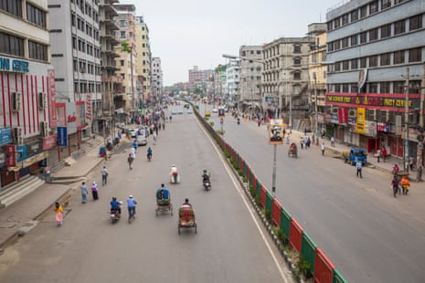A nearly deserted thoroughfare cutting through the middle of Dhaka