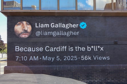 a mural displaying an X post by Liam Gallagher, saying ‘Because Cardiff is the b*ll*x