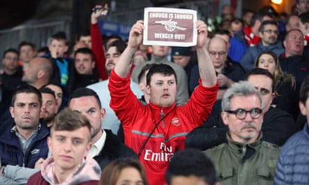 An Arsenal supporter makes clear his feelings at Selhurst Park on Monday night