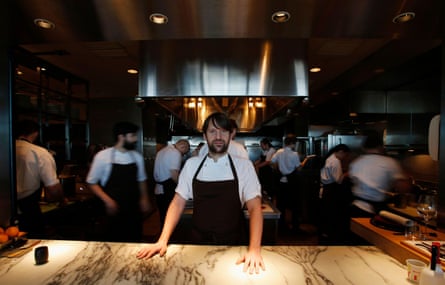 René Redzepi standing in Noma’s kitchen surrounded by staff hard at work