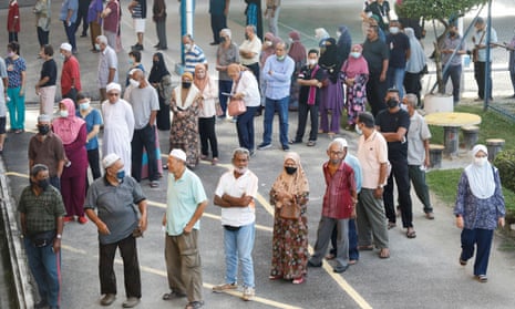 People queue to cast their vote in Permatang Pauh, Penang, Malaysia.