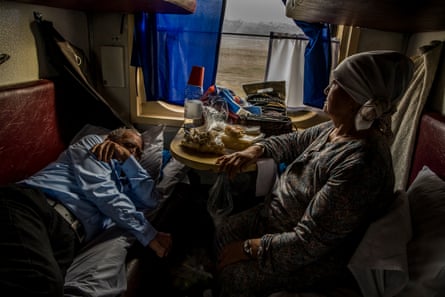 A Kazakh couple on their way to Kyzylorda from Almaty (a 23-hour journey) sat in their compartment. The train remains the mode of transport for the classes less favoured by the economic boom in Kazakhstan. The distances between cities are very long and it takes hours to get from one to the other.
