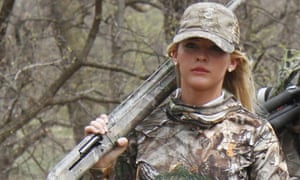 Theresa Vail walks with a hunting party in Chase County, Kansas. Vail, a former beauty queen, is among the members of Donald Trump Jr’s ‘second amendment coalition’.