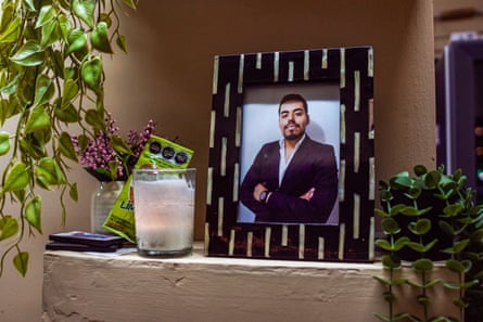 a photo of a man in a photoframe on a shelf