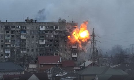 An apartment building explodes after a Russian army tank fires in Mariupol, 11 March
