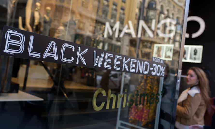 A shopper enters a Mango retail store advertising ‘Black Friday’ discounts in Madrid, Spain.