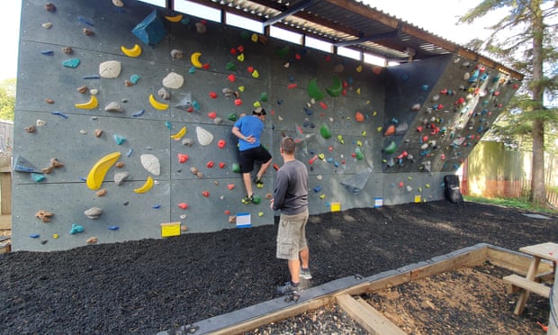 Outdoor bouldering wall at Far Peak adventure hub in the Cotswolds, UK.