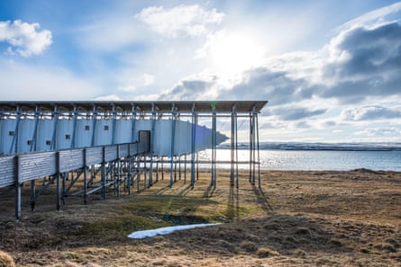 Structure on poles close to waterfront in peaceful scenery